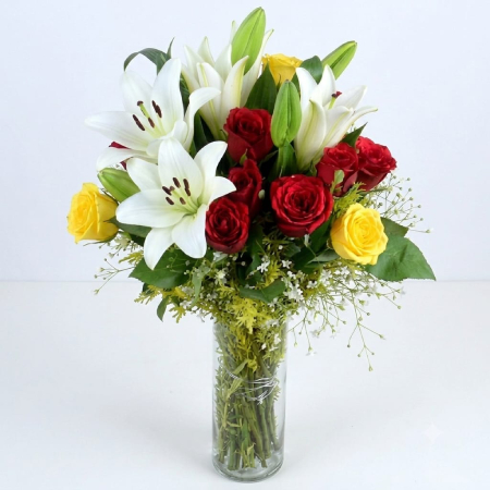 10 red yellow roses n 4 white lilies in a vase